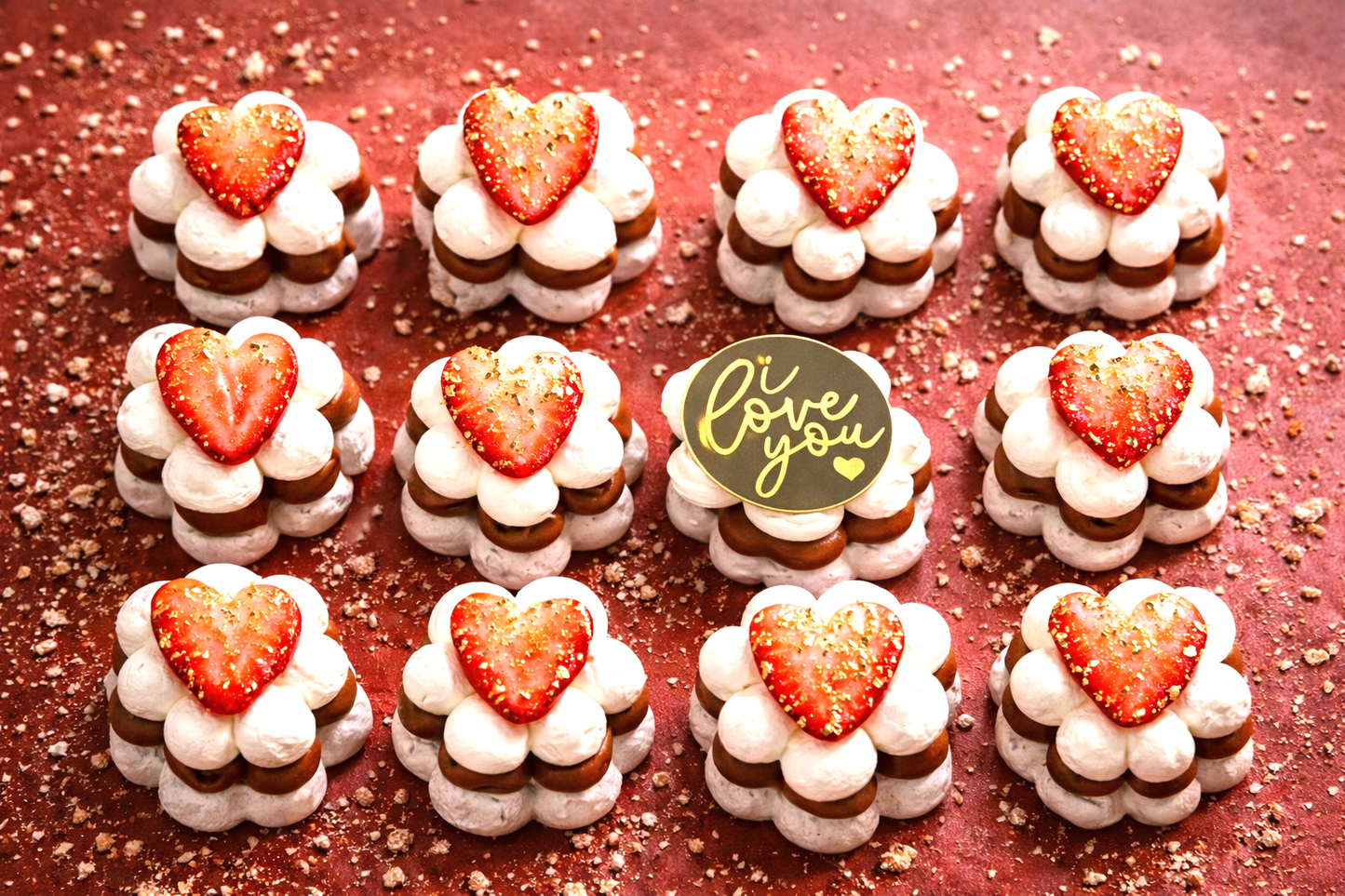 Twelve bite size Golden Pavlovas made with gluten free meringue, dulce de leche or Nutella, whipped cream, strawberries and signature golden flakes.