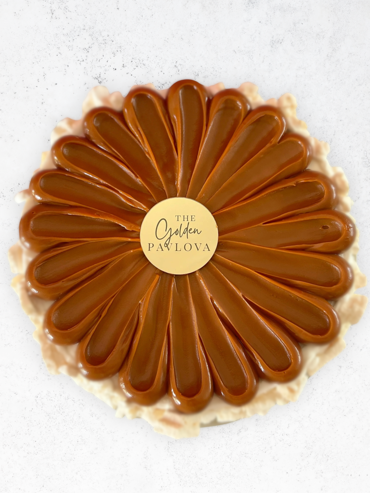 Gluten free artisanal ice cream pavlova cake layered with crunchy meringue, dulce de leche, and strawberry, 11-inch cake available for pickup only.