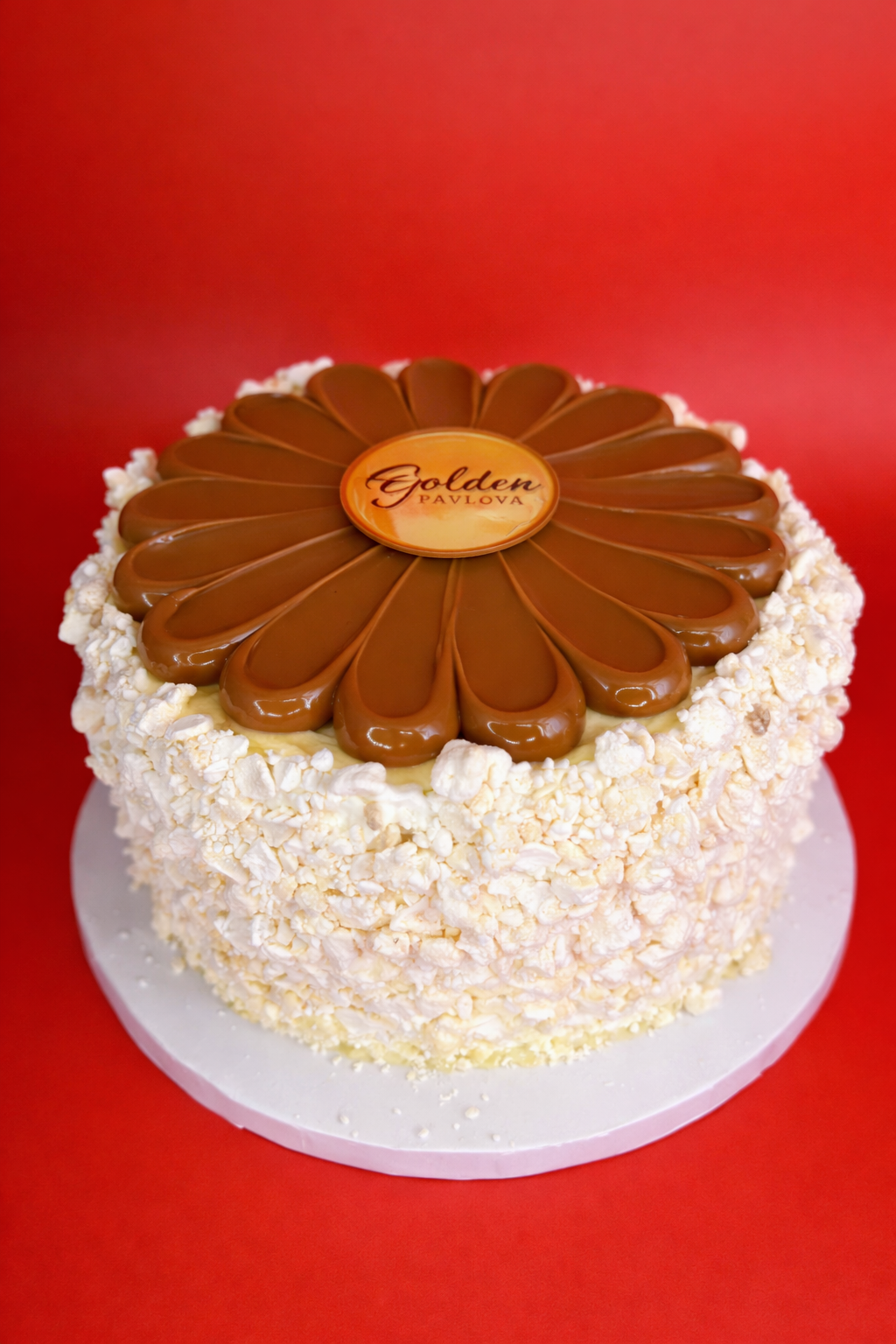 Gluten free artisanal ice cream cake layered with crunchy meringue, dulce de leche, and strawberry, available for pickup only.